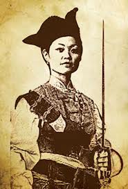 A printing on yellowed paper of a Chinese woman in armor, holding a sword.