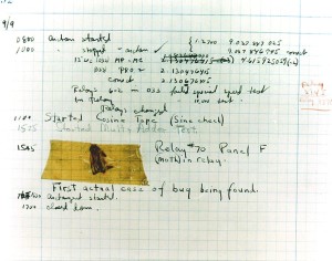 A moth has been taped to a piece of graph paper. Notes describe it as a bug which fell into the machine.